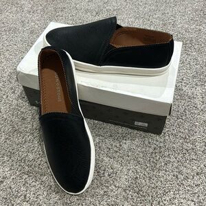 Black snakeskin slip on flats